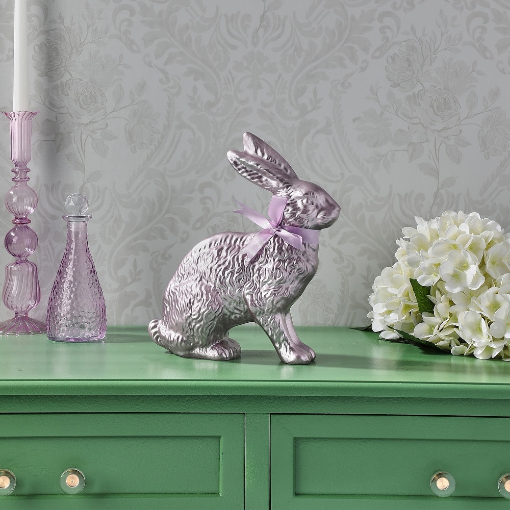 Ten-inch resin Easter bunny with shimmering foil finish and satin ribbon accent