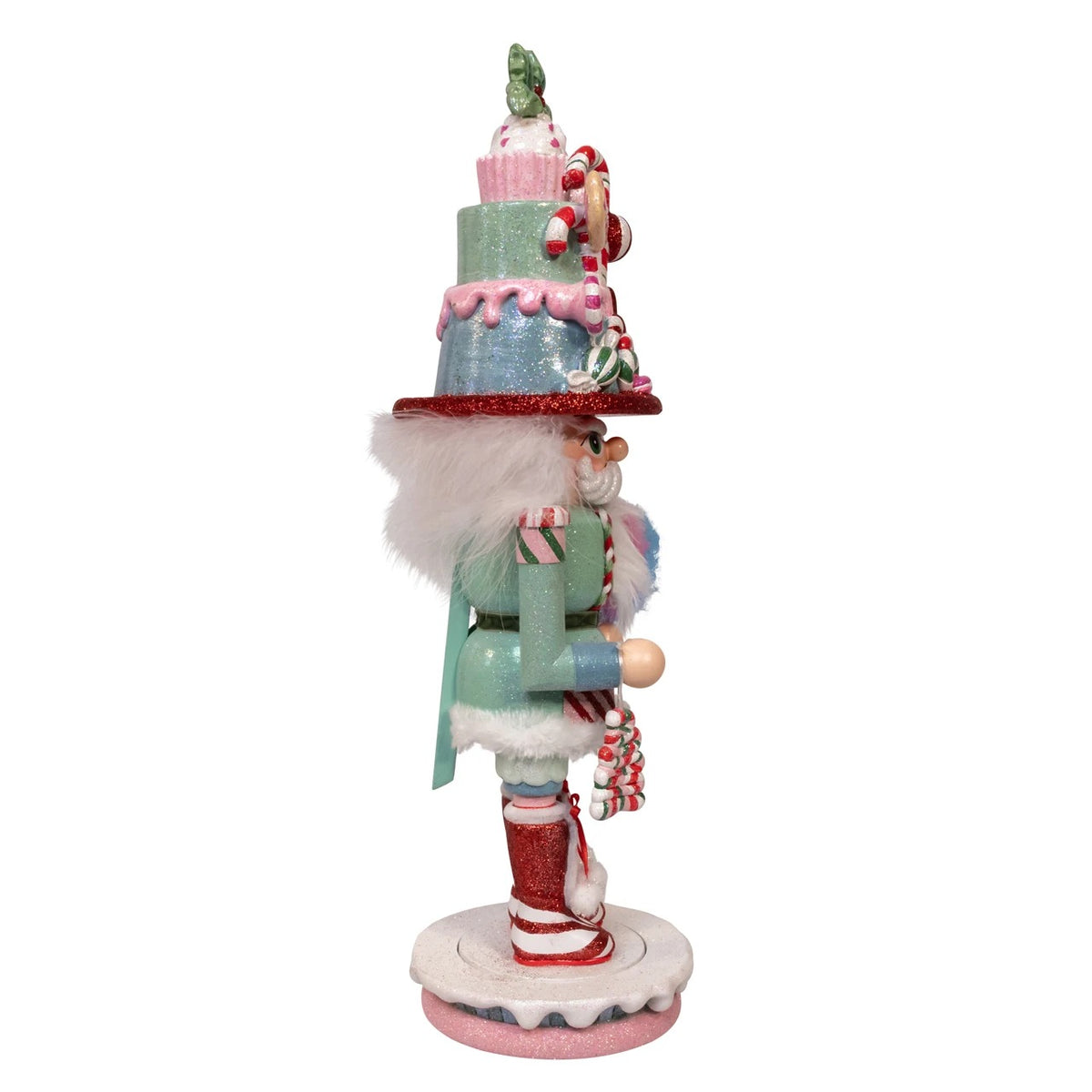 Side view of an 18-inch Hollywood Nutcracker with a tiered candy hat and cotton candy details.