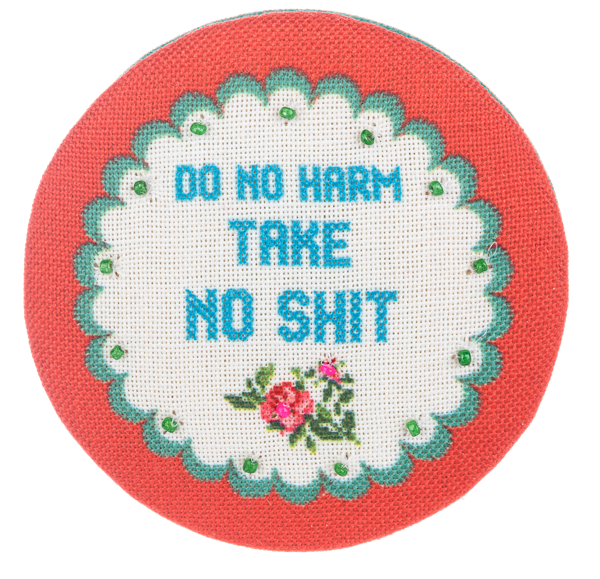 Multi-colored embroidered compact mirror with a cheeky chic floral pattern.
