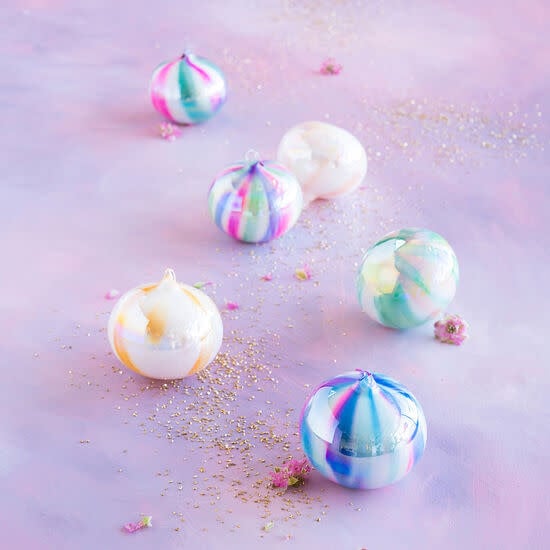 Hand-painted watercolor orb ornament with shimmering accents in a swirled pattern.