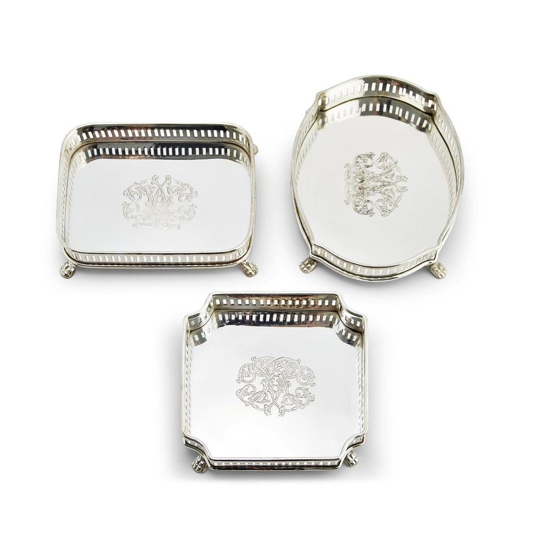 Three silver-plated Galway gallery trays in rectangular, oval, and square shapes with engravings.