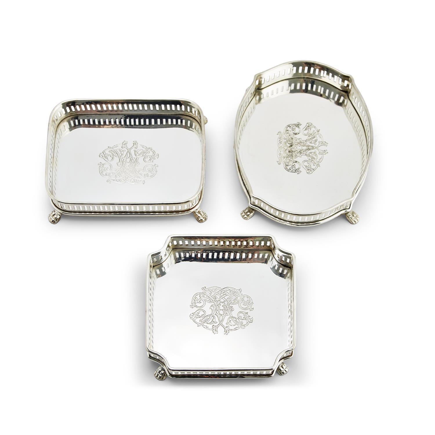 Three silver-plated Galway gallery trays in rectangular, oval, and square shapes with engravings.