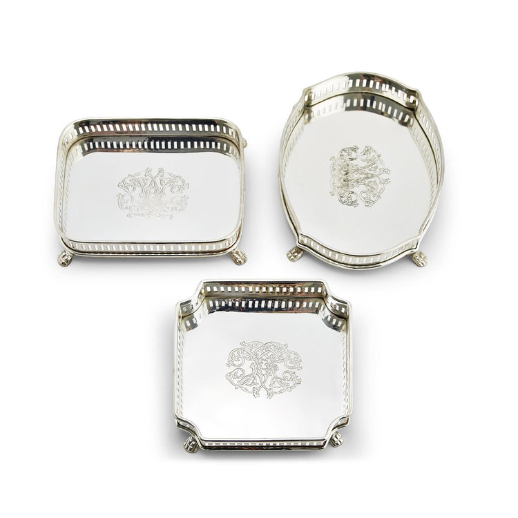 Three silver-plated Galway gallery trays in rectangular, oval, and square shapes with engravings.