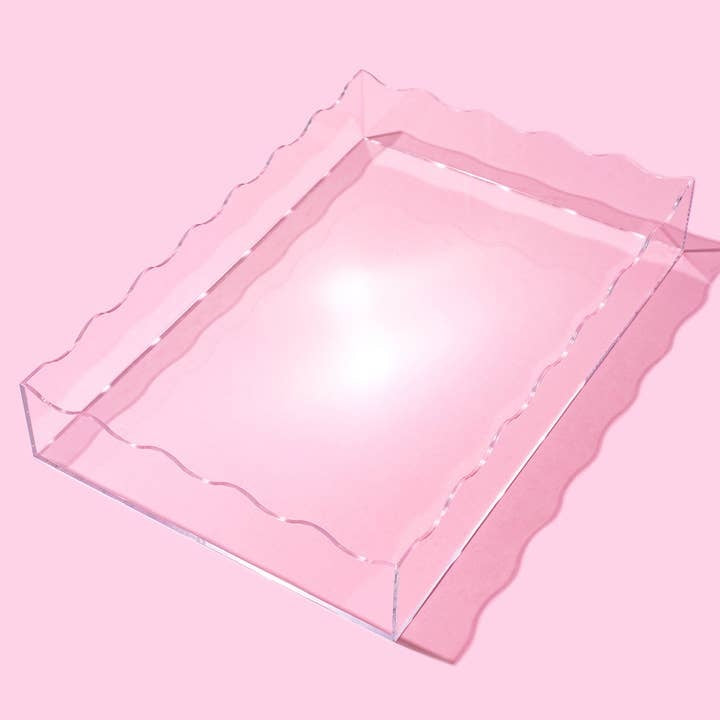 Large clear acrylic tray with wavy rectangular edges measuring 13 by 18 inches.