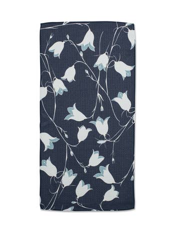 Navy blue mini towel with a white and light blue bellflower floral pattern.