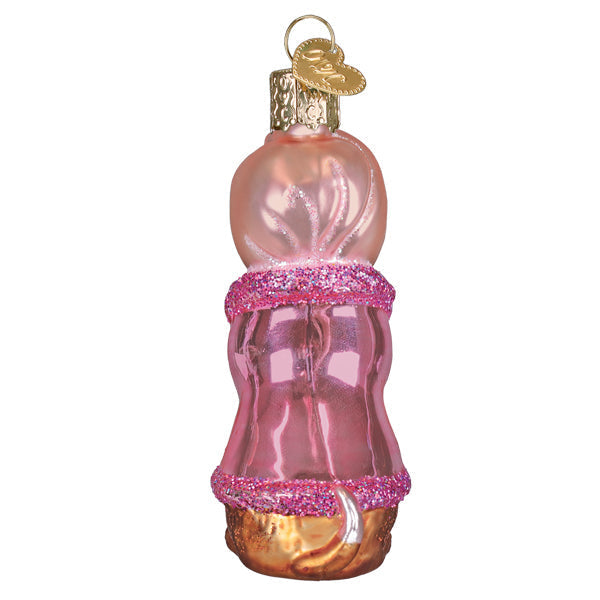 Back view of a pink glass Spa Dog ornament with glitter trim and a gold heart charm.
