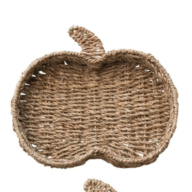 Hand-woven seagrass tray shaped like a pumpkin in neutral tones