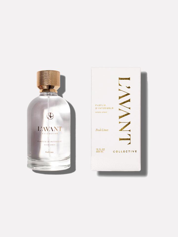 Clear glass bottle containing Fresh Linen room spray with a white pump dispenser.