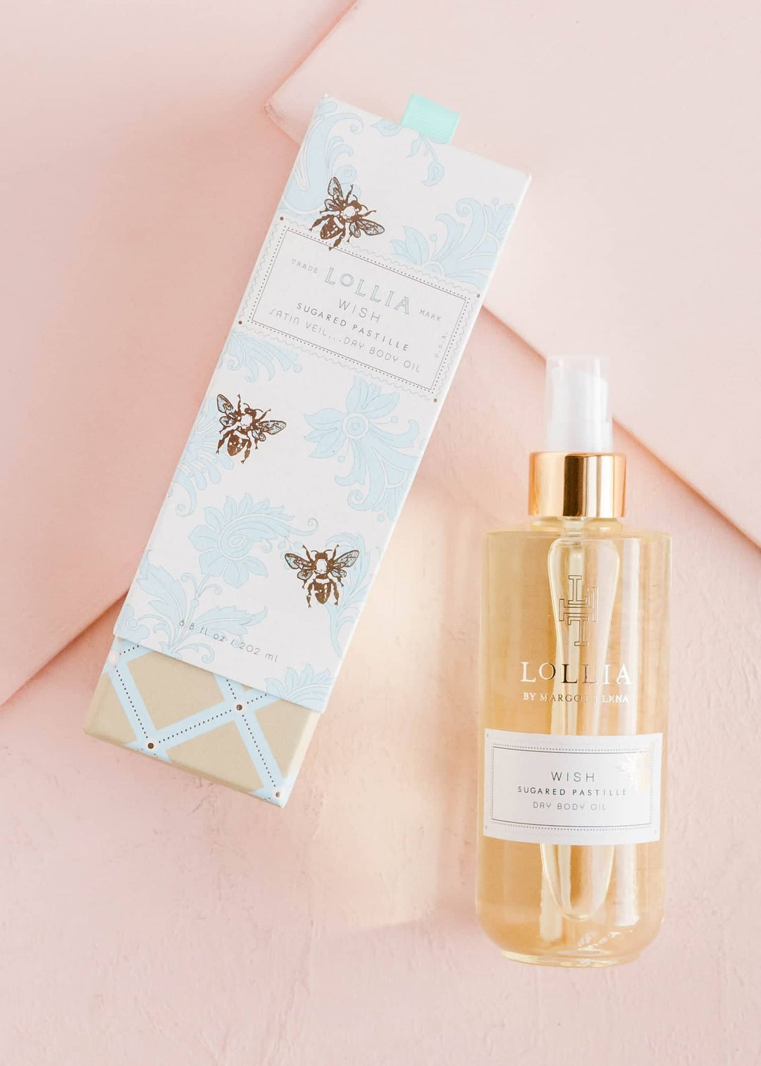 Bottle of Wish Dry Body Oil with pomegranate green tea scent in clear glass