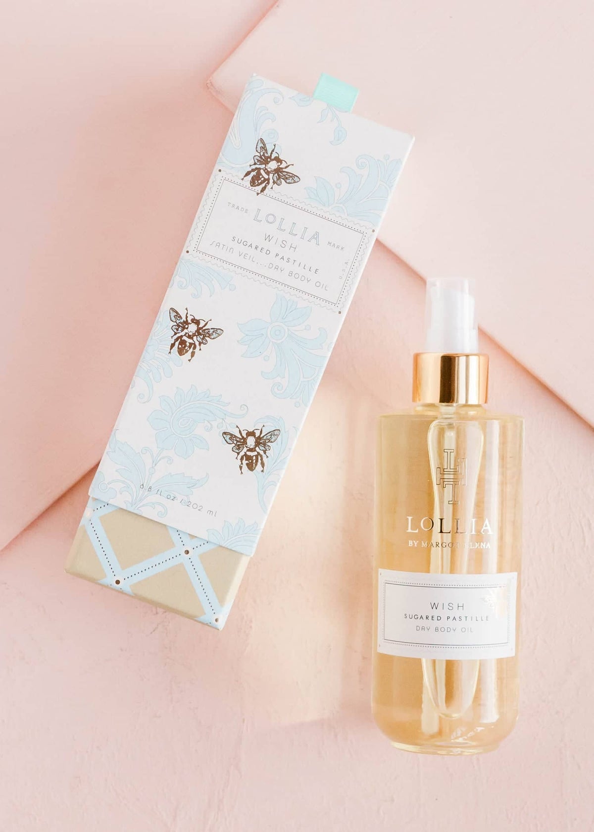 Bottle of Wish Dry Body Oil with pomegranate green tea scent in clear glass