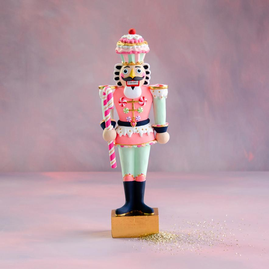Gold Colonel Cupcake Figure, a 20-inch pastel pink and mint green nutcracker with a cupcake hat.