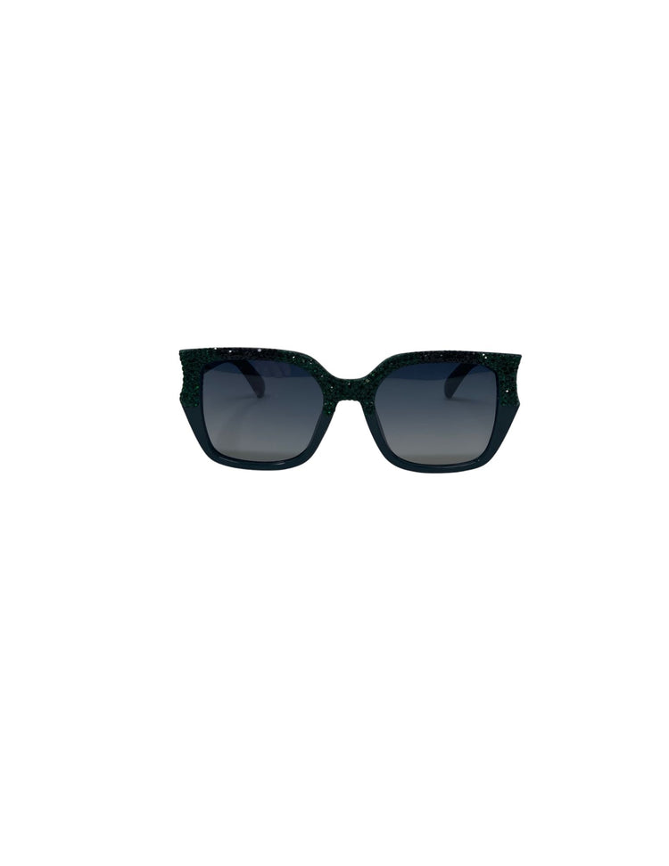 Black square sunglasses with dark gradient lenses and green rhinestone embellishments on the frame.