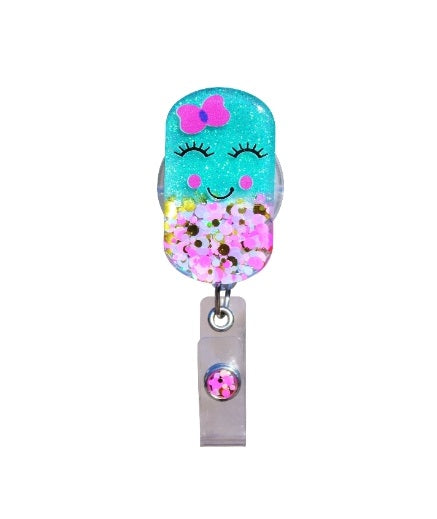 Glitterific badge reel with a glitter resin pin featuring an adorable sparkly silhouette on a black alligator clip.