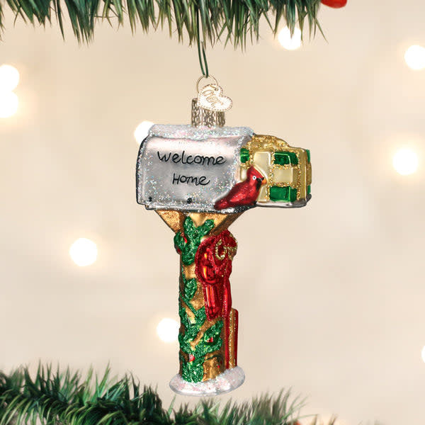 Mouth-blown glass mailbox ornament with silver interior, hand-painted colorful lacquers and glitter details.
