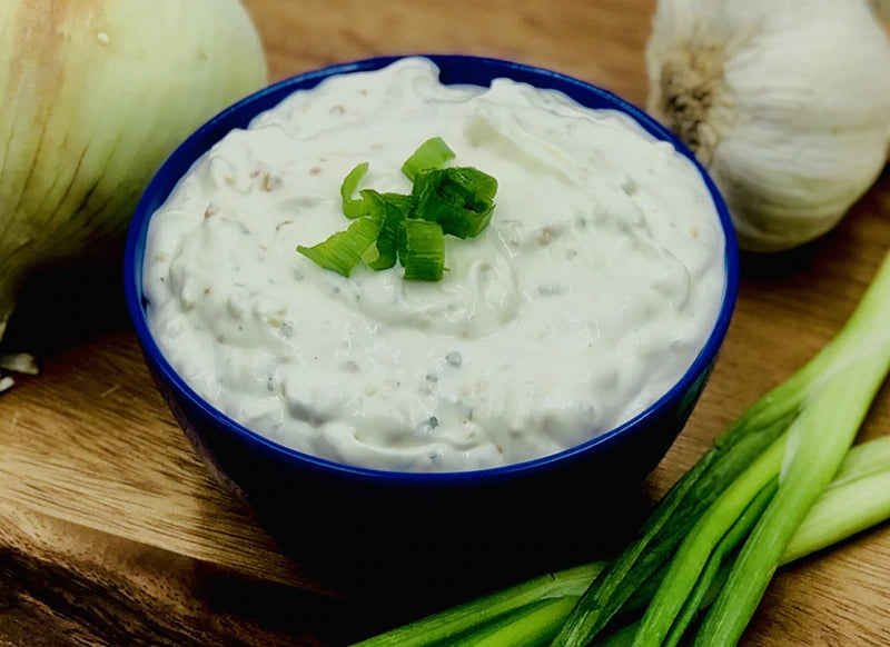 Jar of Roasted Garlic Dip with visible creamy texture