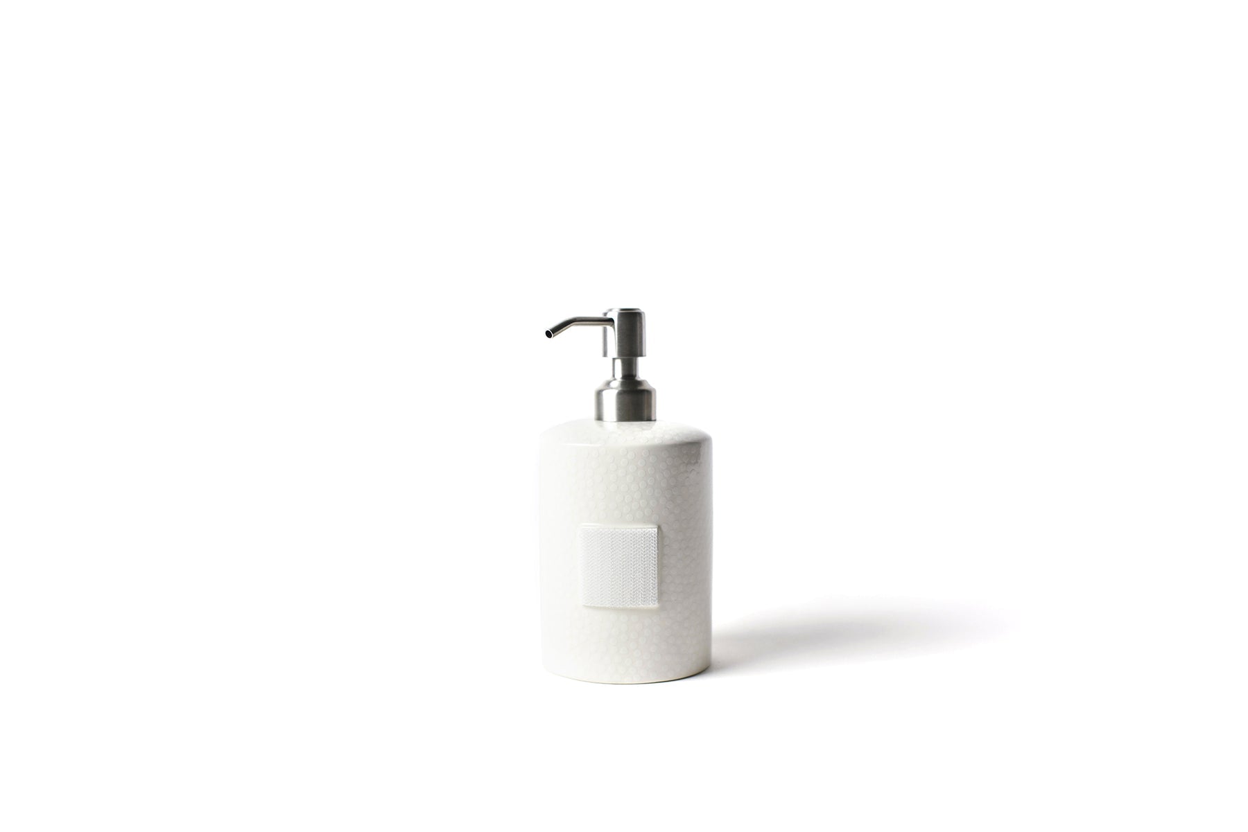 White ceramic mini cylinder soap pump with small dot pattern and hook-and-loop fastener.