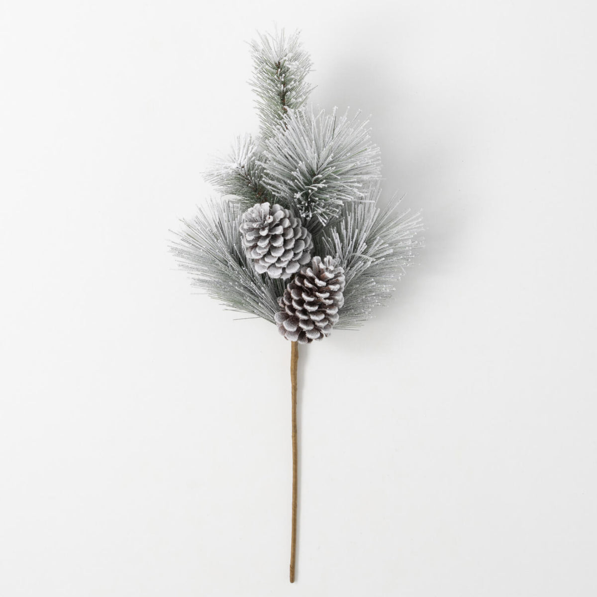 Flocked green pine spray with two snow-dusted pinecones on a long brown stem.