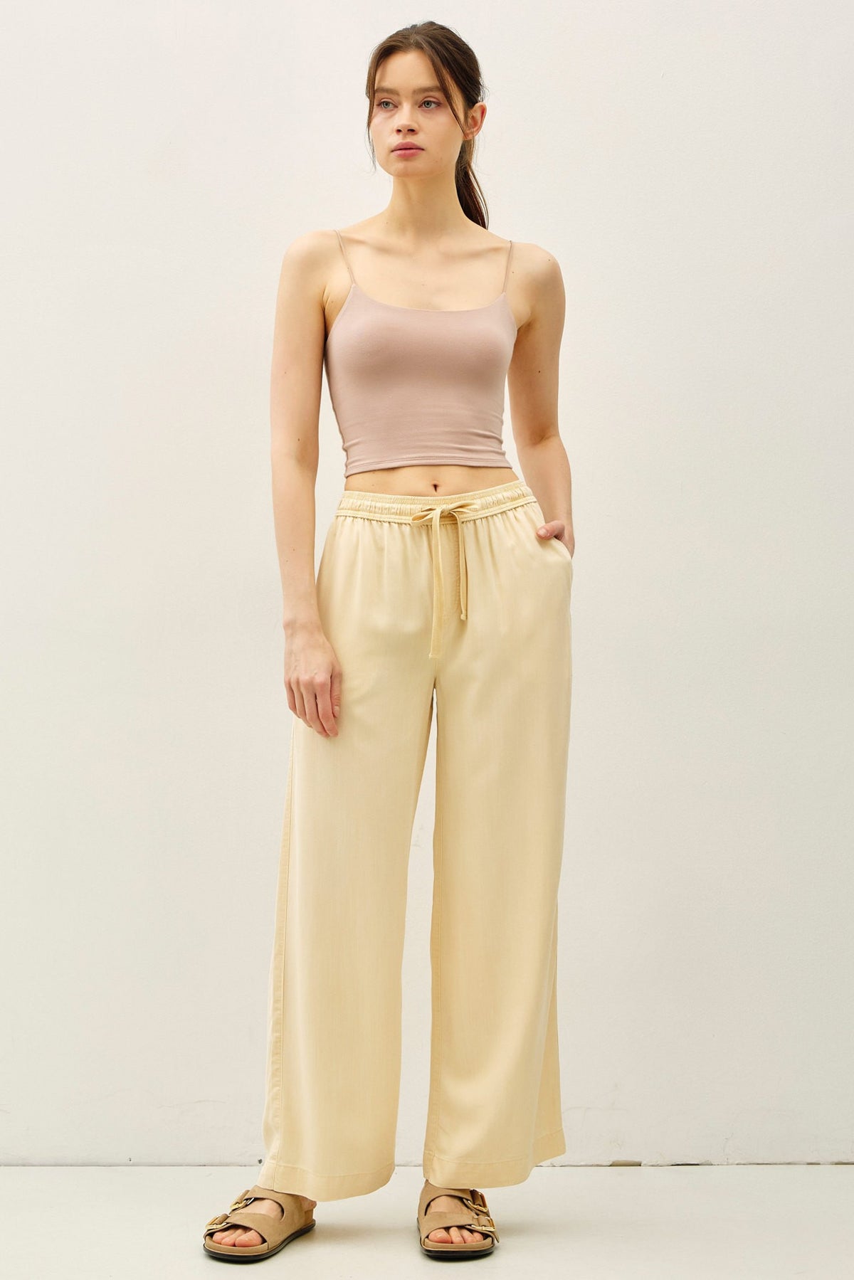 Women's Jane Tencel wide-leg pant in neutral tone with elastic waistband and side pockets.