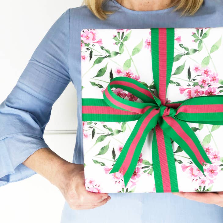 Pink geranium floral gift wrap sheet on white background