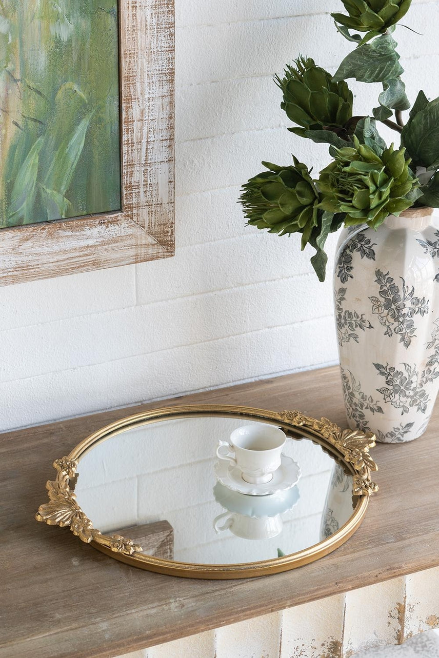 Gold iron frame mirror tray with intricate floral cutout patterns