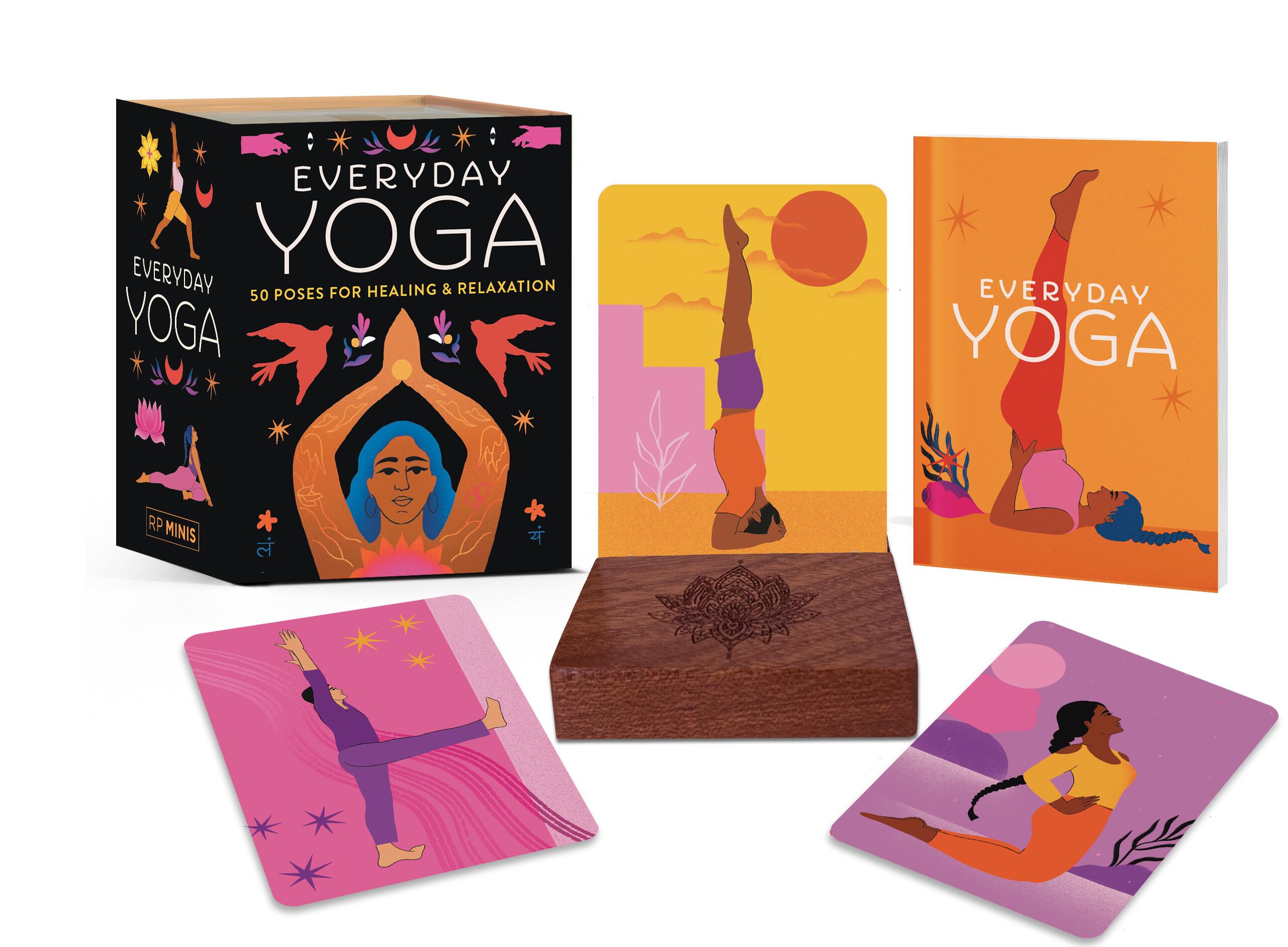Wooden stand holding a portable yoga card deck with an illustrated mini book.