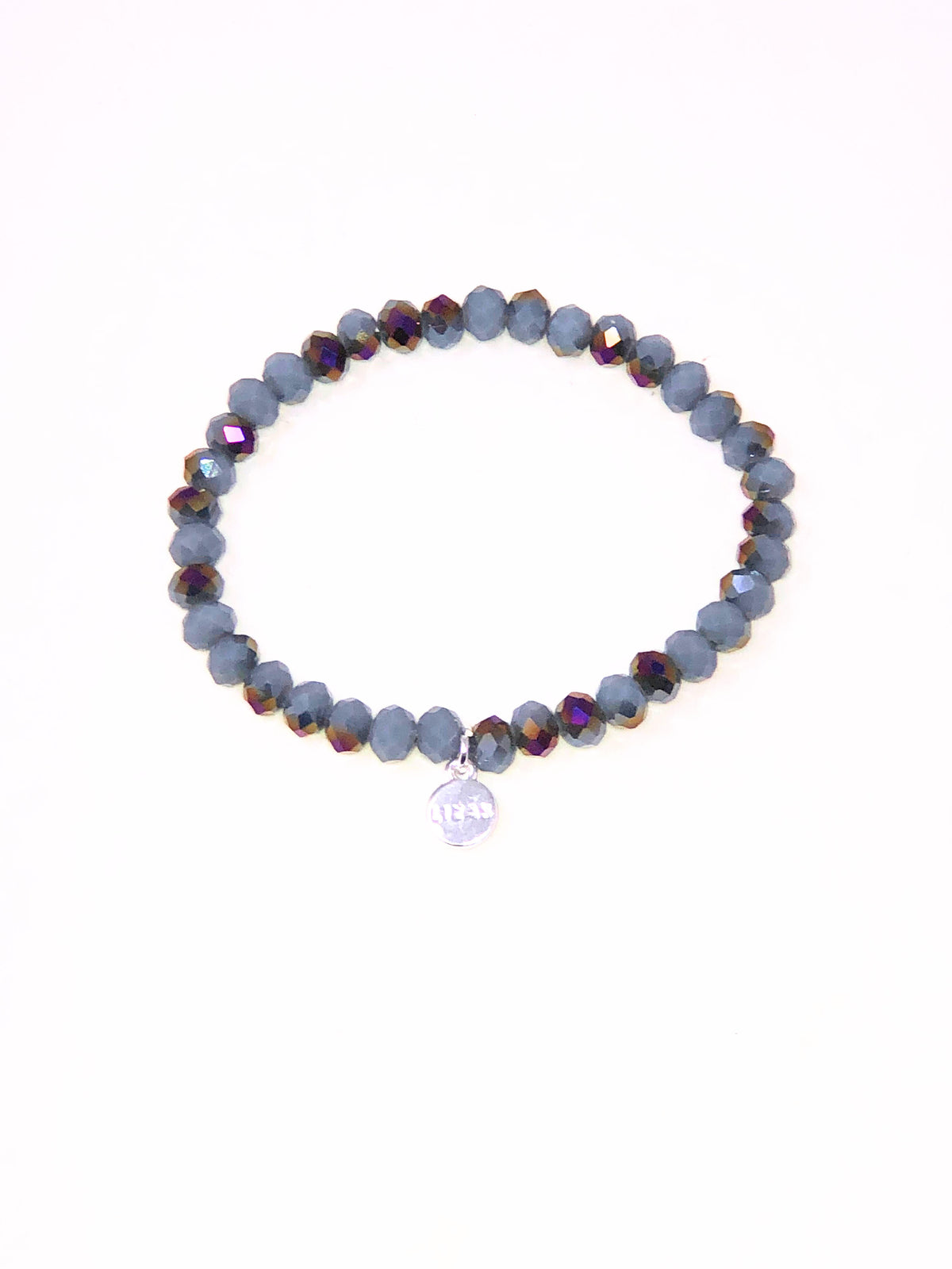 Stretchy bracelet with faceted glass beads in mixed colors on a white background.