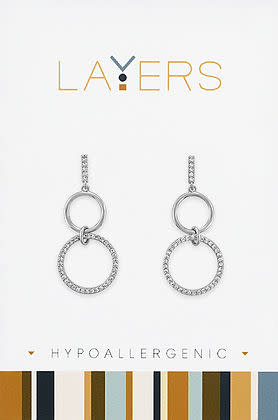 Silver double circle stud earrings with CZ accents on a Layers brand card.
