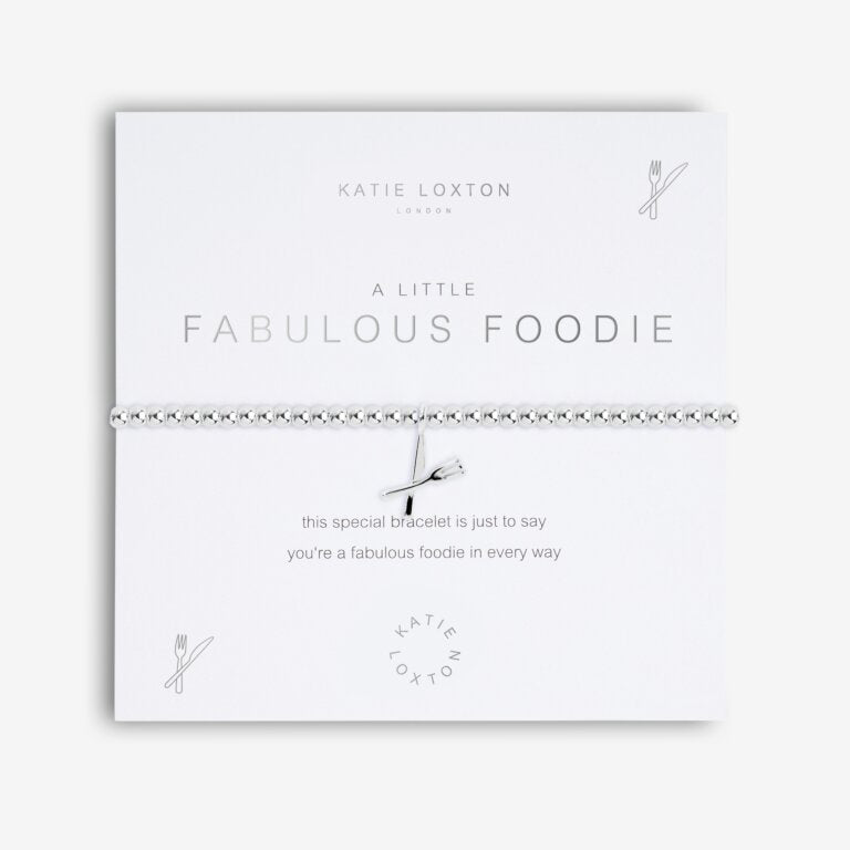 Silver beaded bracelet with a knife and fork charm on a white card titled A Little Fabulous Foodie.