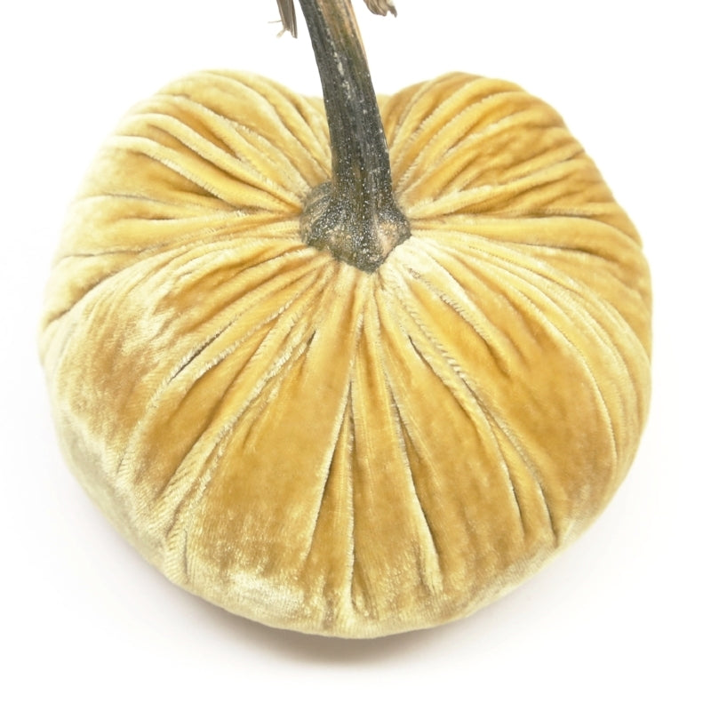 Handmade orange velvet pumpkin with a natural stem.