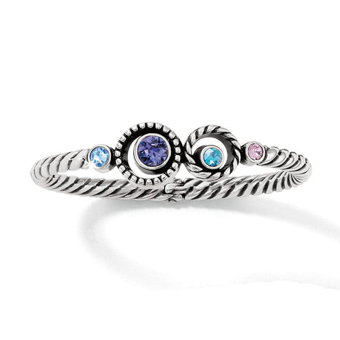 Silver-plated hinged bangle with silver-tanzanite crystal accents