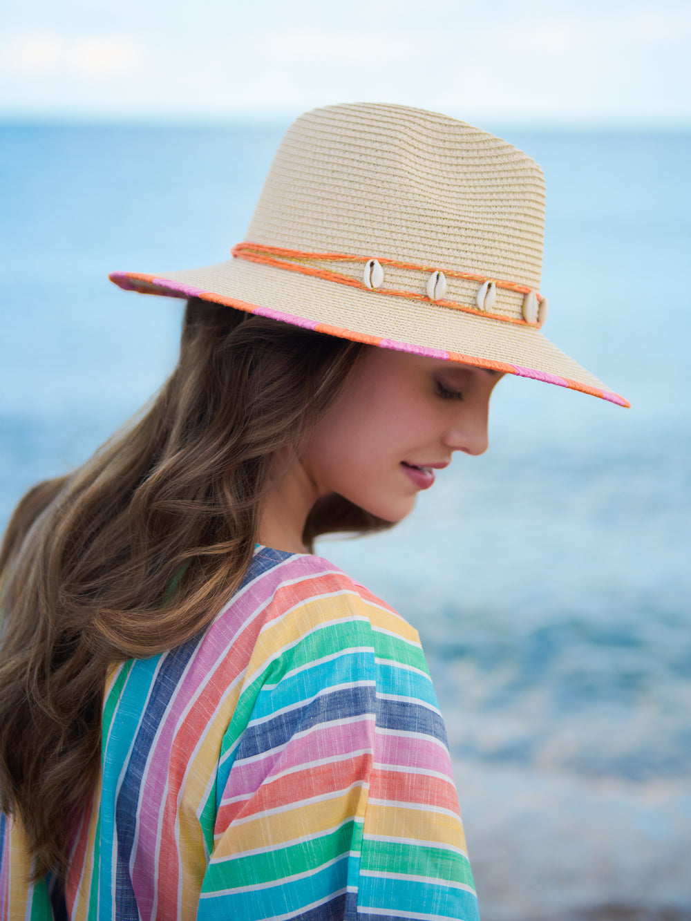 Natural-colored Riviera hat with a wide brim and woven texture.