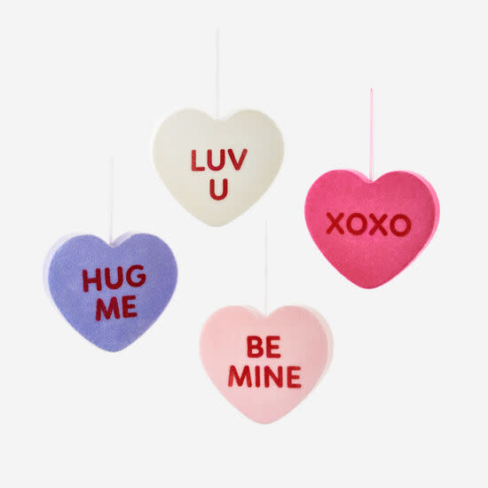 Hanging flocked conversation heart ornament in pink PVC with white polka dots.