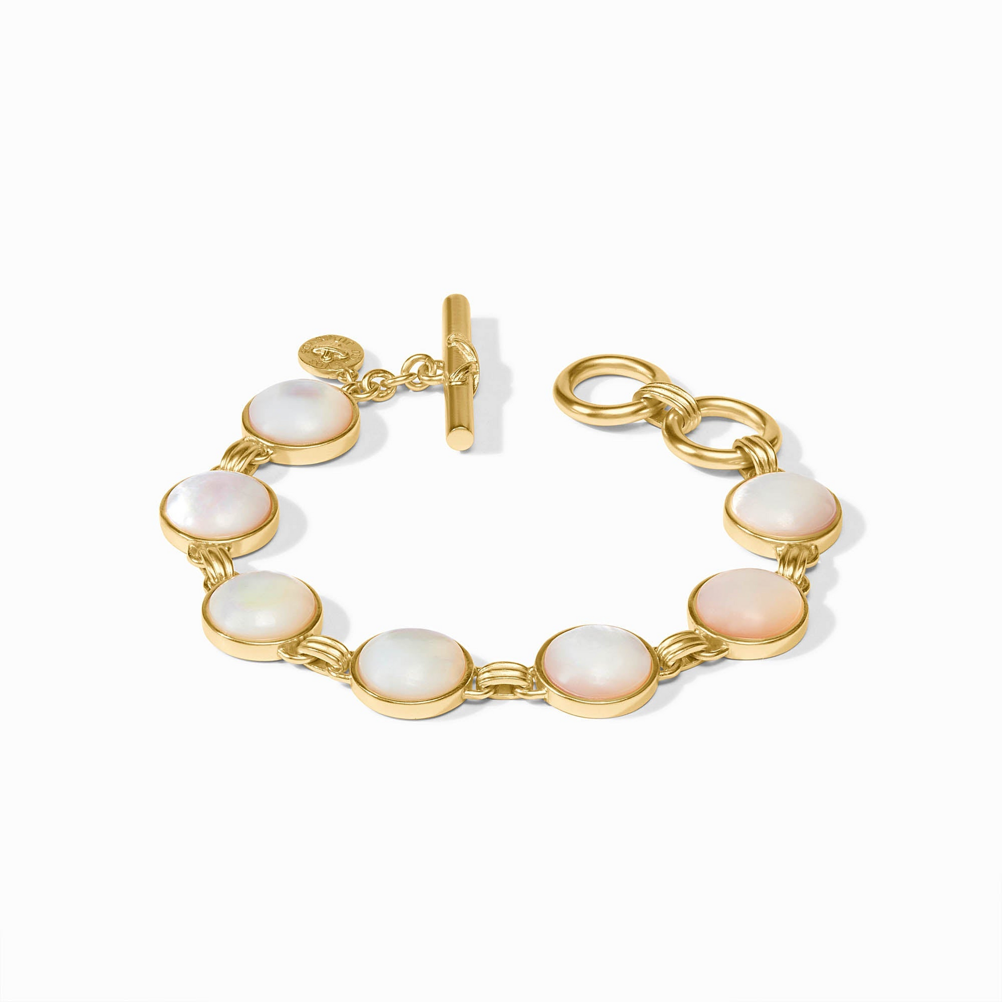 Gold Essex Stone Bracelet with seven round mother of pearl stones and a toggle closure.