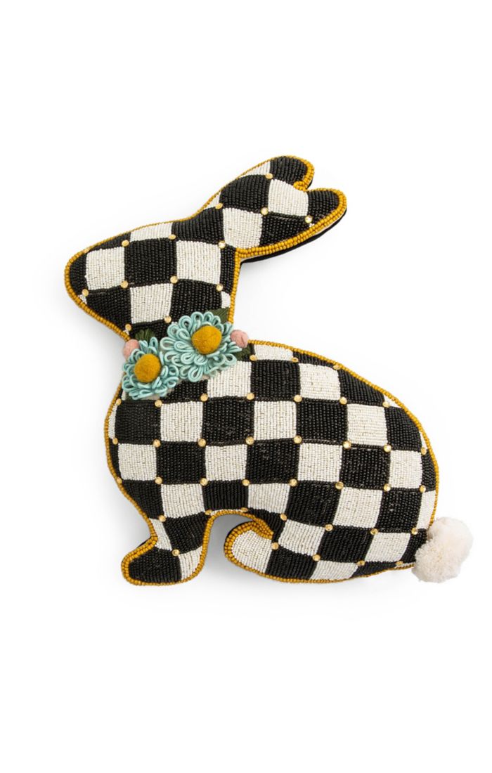 Beaded bunny pillow with a black and white checkered pattern and blue floral collar.