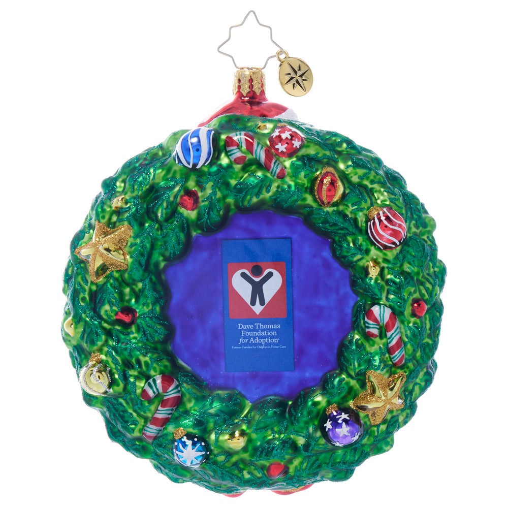 Wreath of Forever Love glass ornament featuring a green wreath with Dave Thomas Foundation logo.