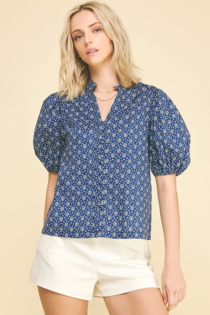 Megan floral print cotton blouse with ruffled V-neck, balloon sleeves, elastic cuffs, and a relaxed silhouette.