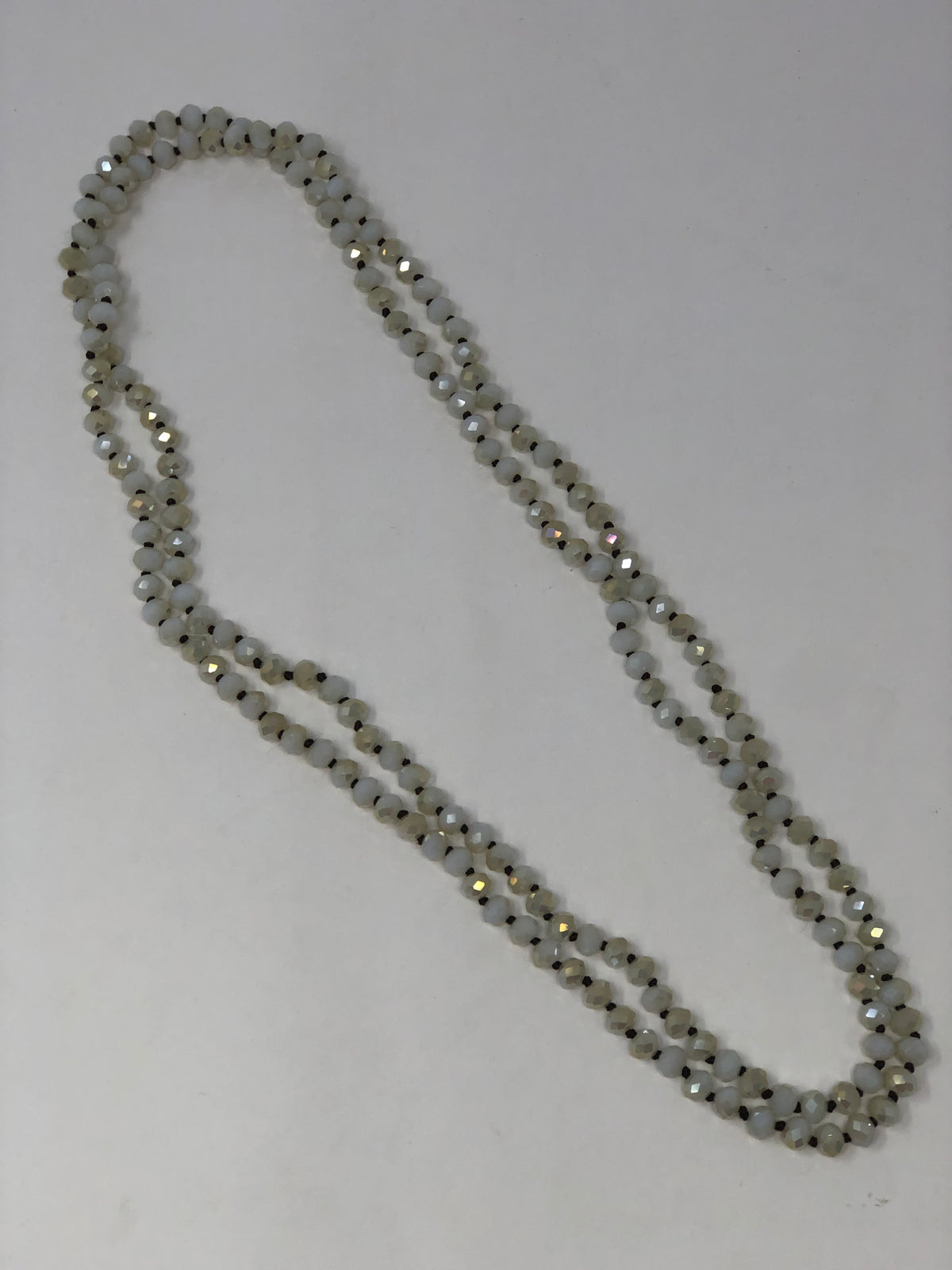 60-inch dark brown crystal beaded necklace with knotting between beads and no clasp