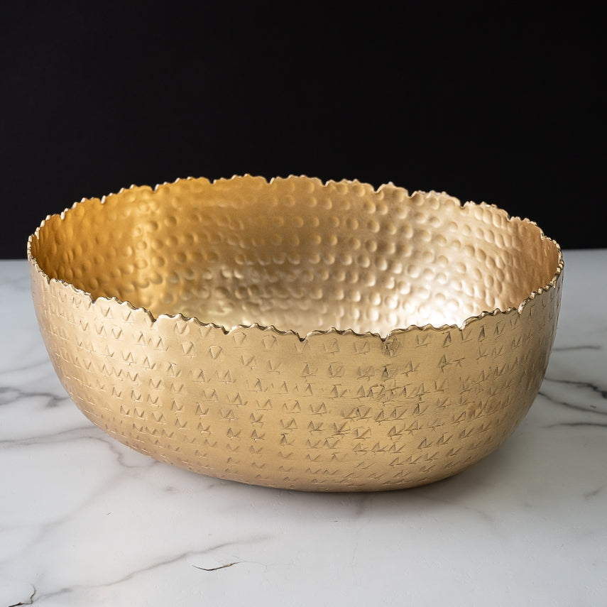 Oval hammered aluminum bowl with a gold finish