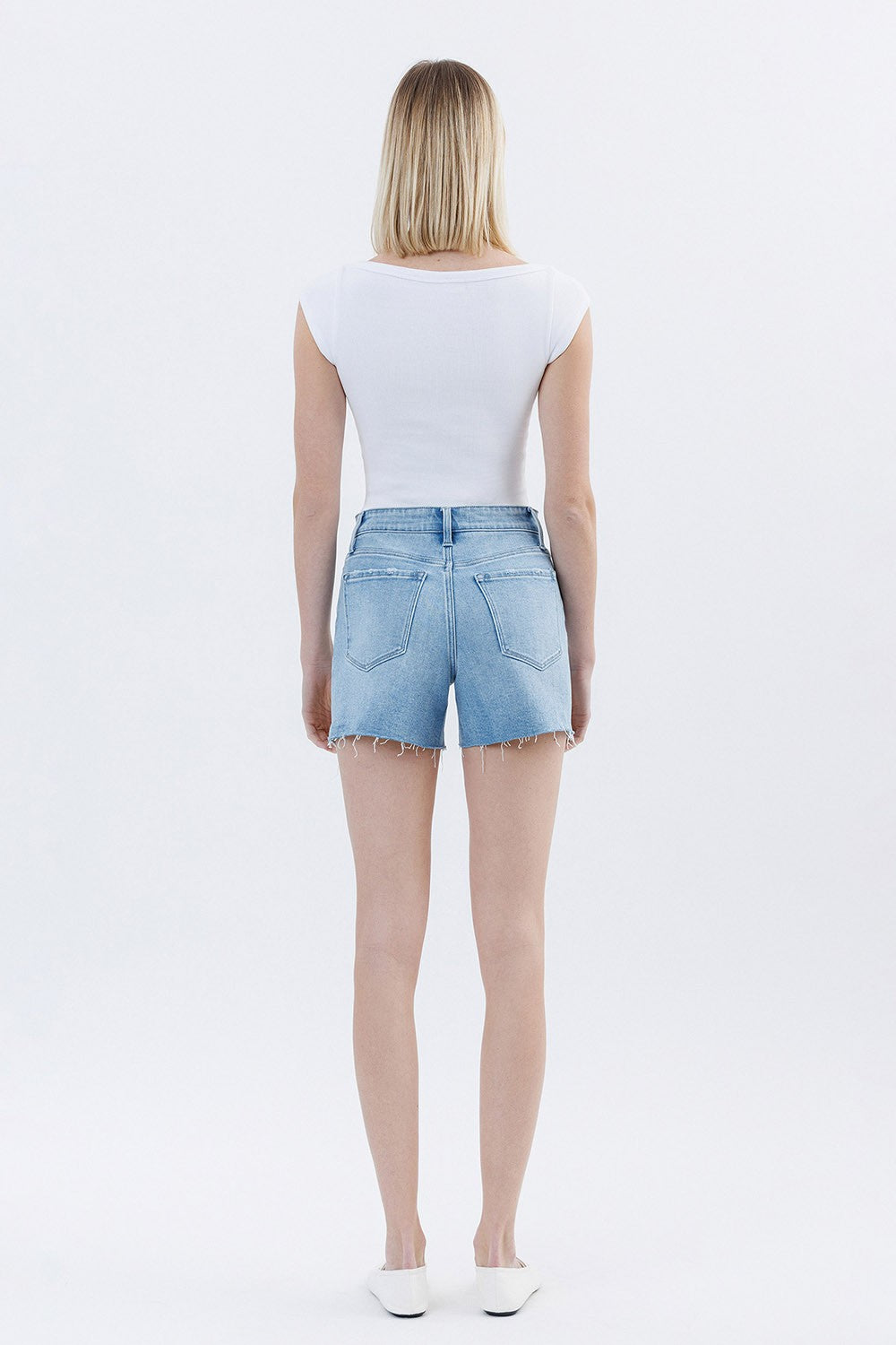 Front view of Rebecca high-rise raw hem denim shorts in light wash with stretch fabric and button fly.