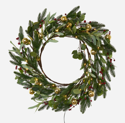 Lighted berry wreath with gold balls featuring a circular silhouette.