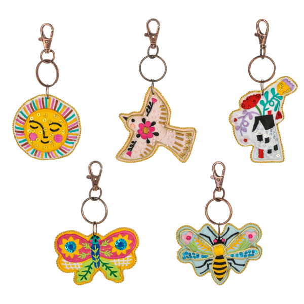 Multi-colored embroidered beaded purse charm with whimsical floral embroidery pattern