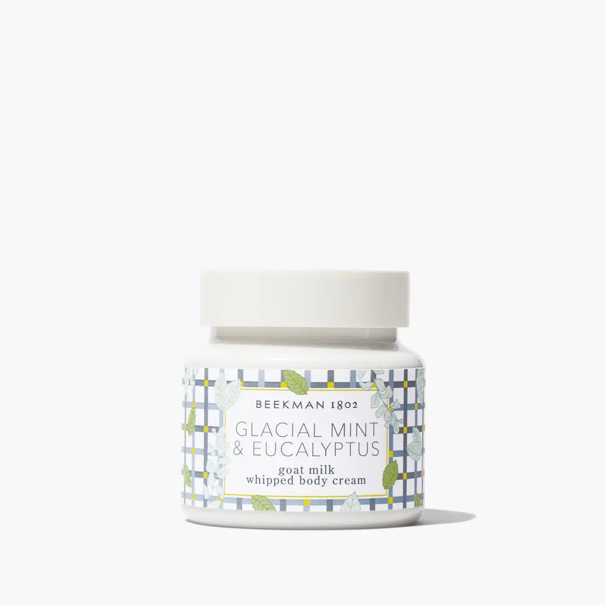 White tub of Whipped Body Cream in Glacial Mint Eucalyptus scent with a silver lid.