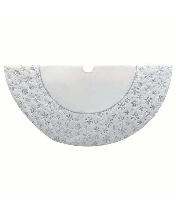 White velvet tree skirt with silver sequined snowflakes, faux fur border, and metallic cord trim.