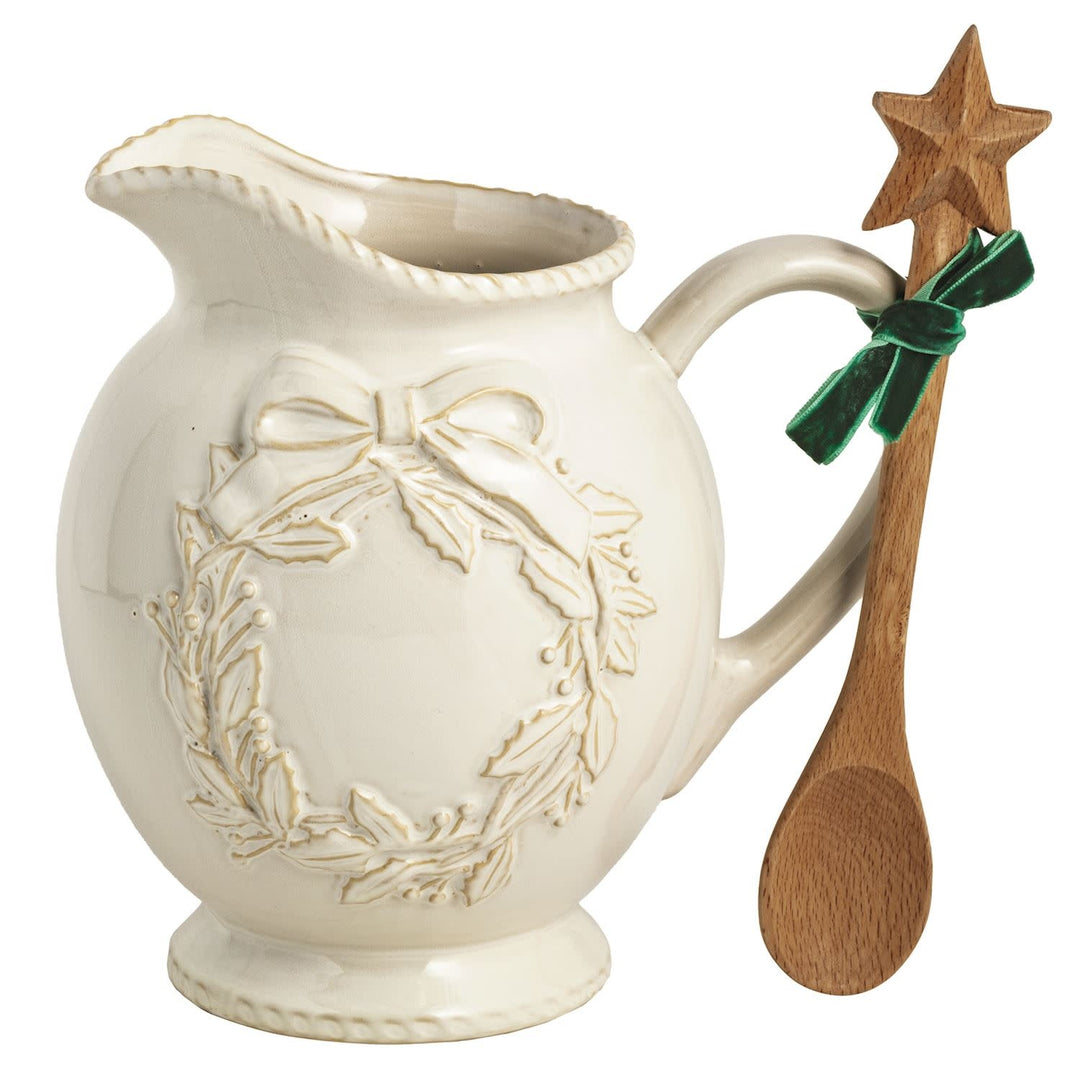 White milk glazed stoneware Christmas pitcher with textured relief and wooden star spoon