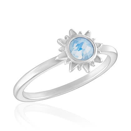 White opal sun stack ring with a delicate floral petal pattern on a polished silver band.