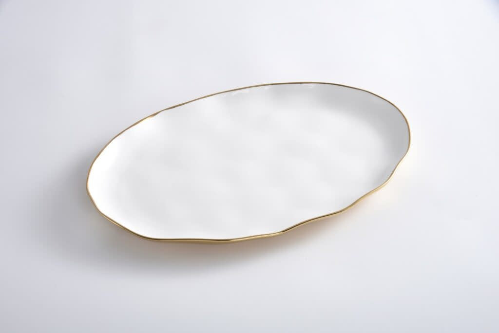 White oval platter with gold titanium accents in high-fired porcelain.