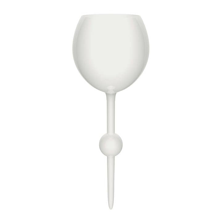 White ceramic beach glass tumbler with a textured sand-like exterior pattern.