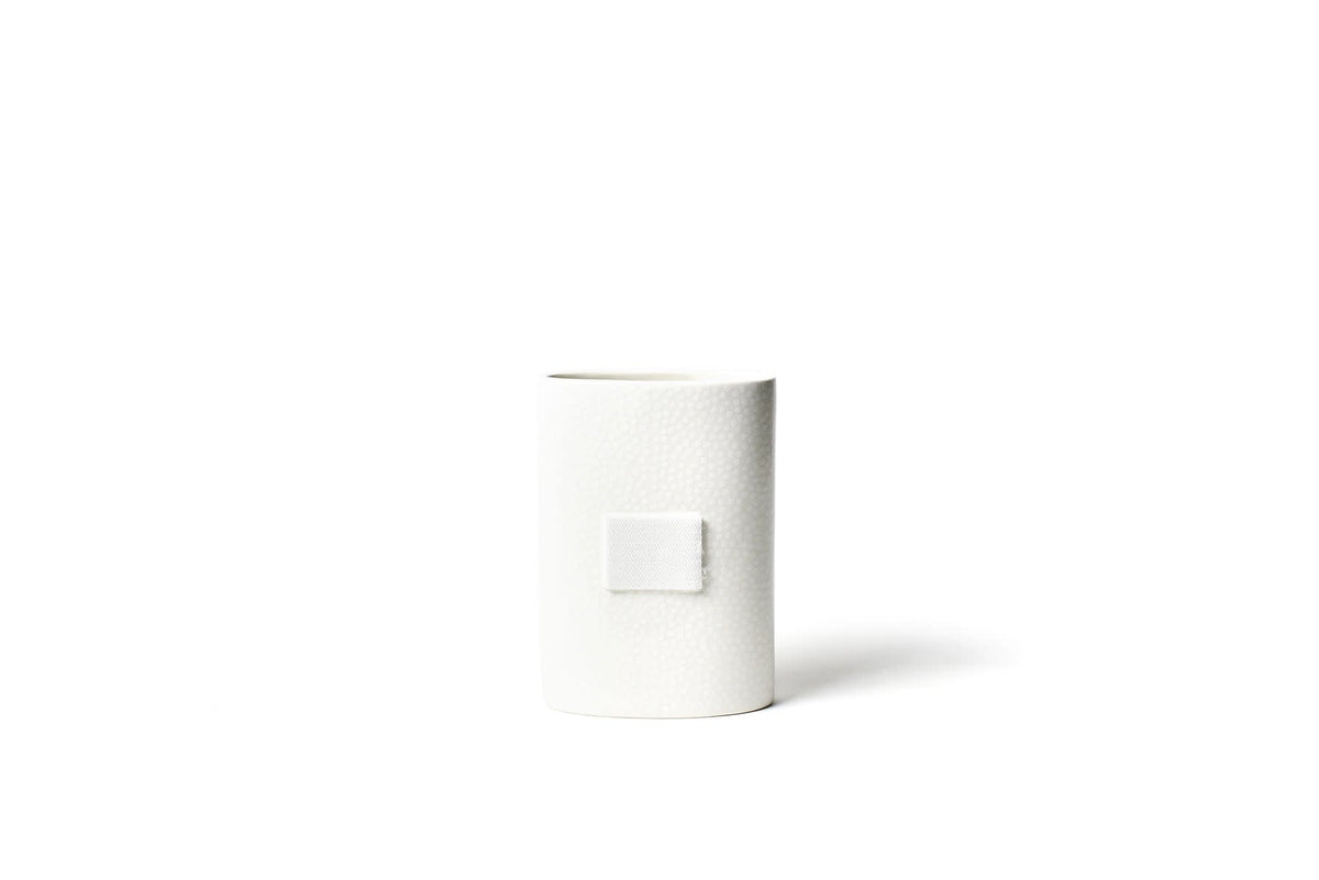 White ceramic mini oval vase with small dot pattern