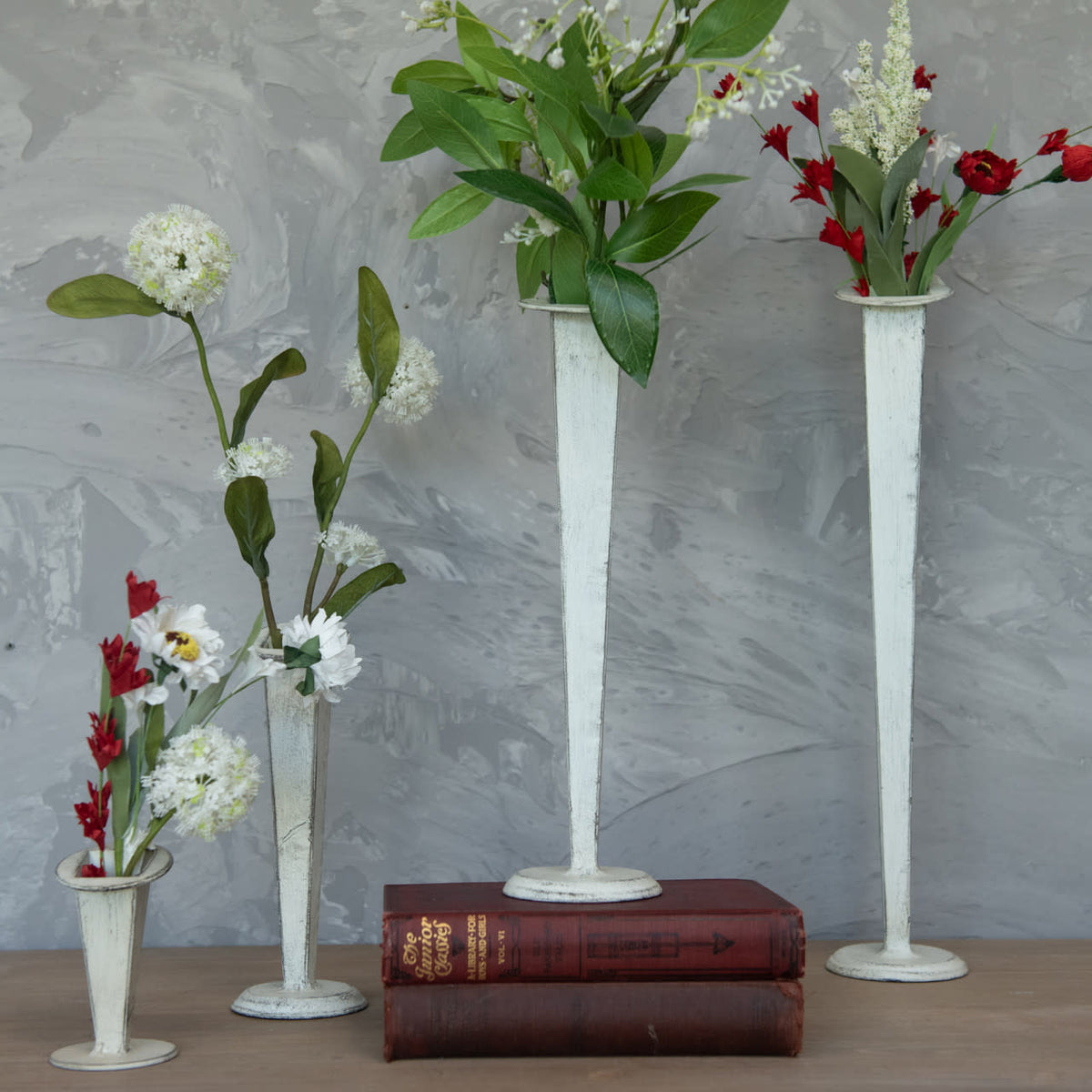 White metal tapered vase with a sleek conical silhouette.