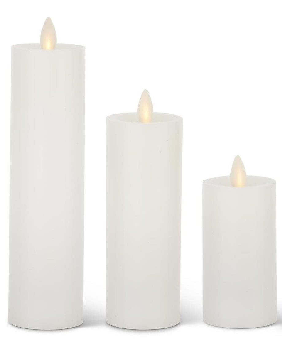 White wax pillar candle with slim cylindrical shape and electronic flame effect.